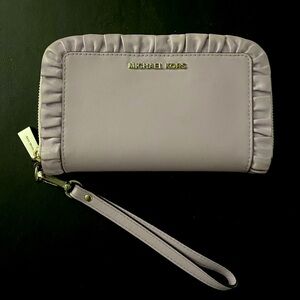 Michael Kors small clutch. Lavender in color.
